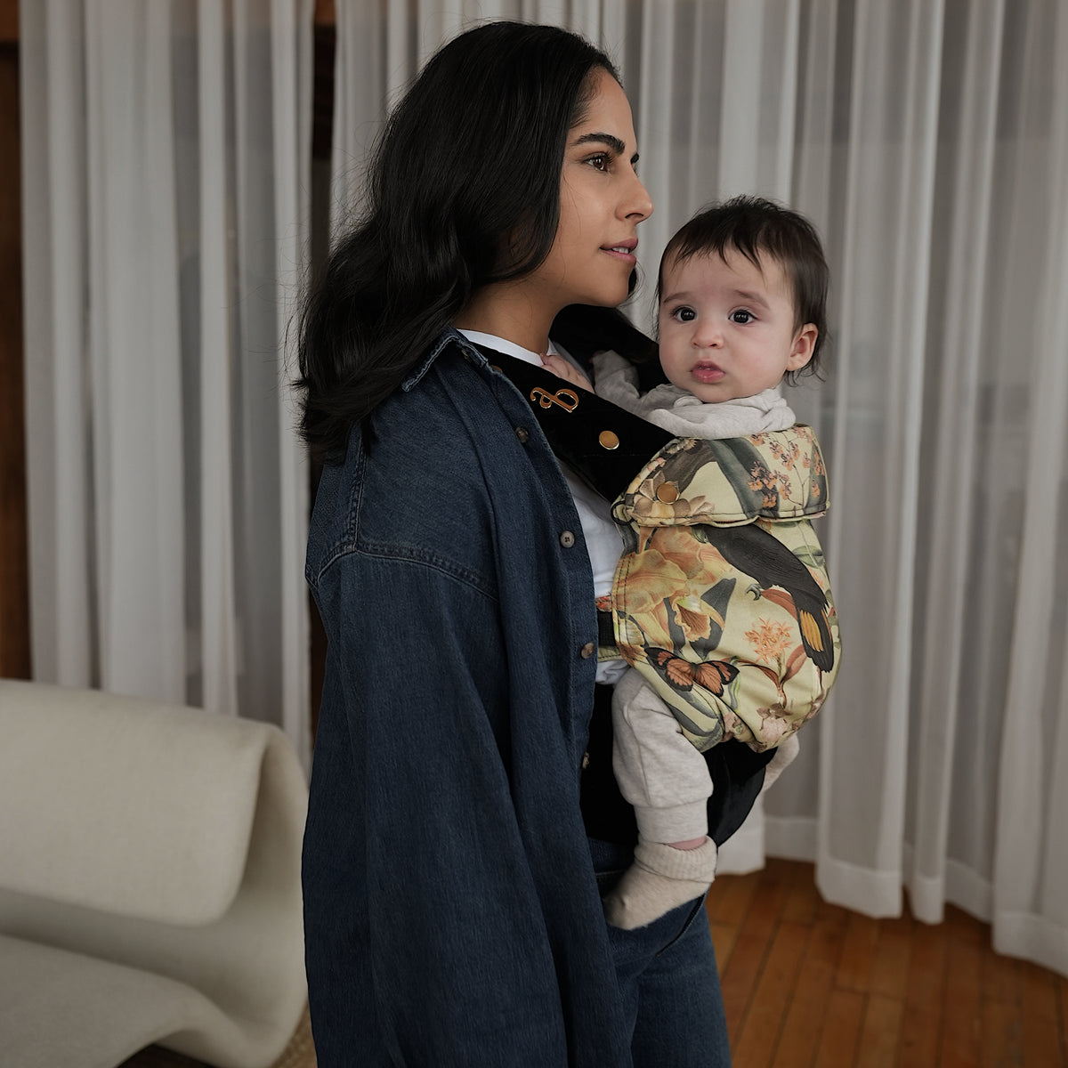 Nicole wearing her baby in an Ariblake baby carrier