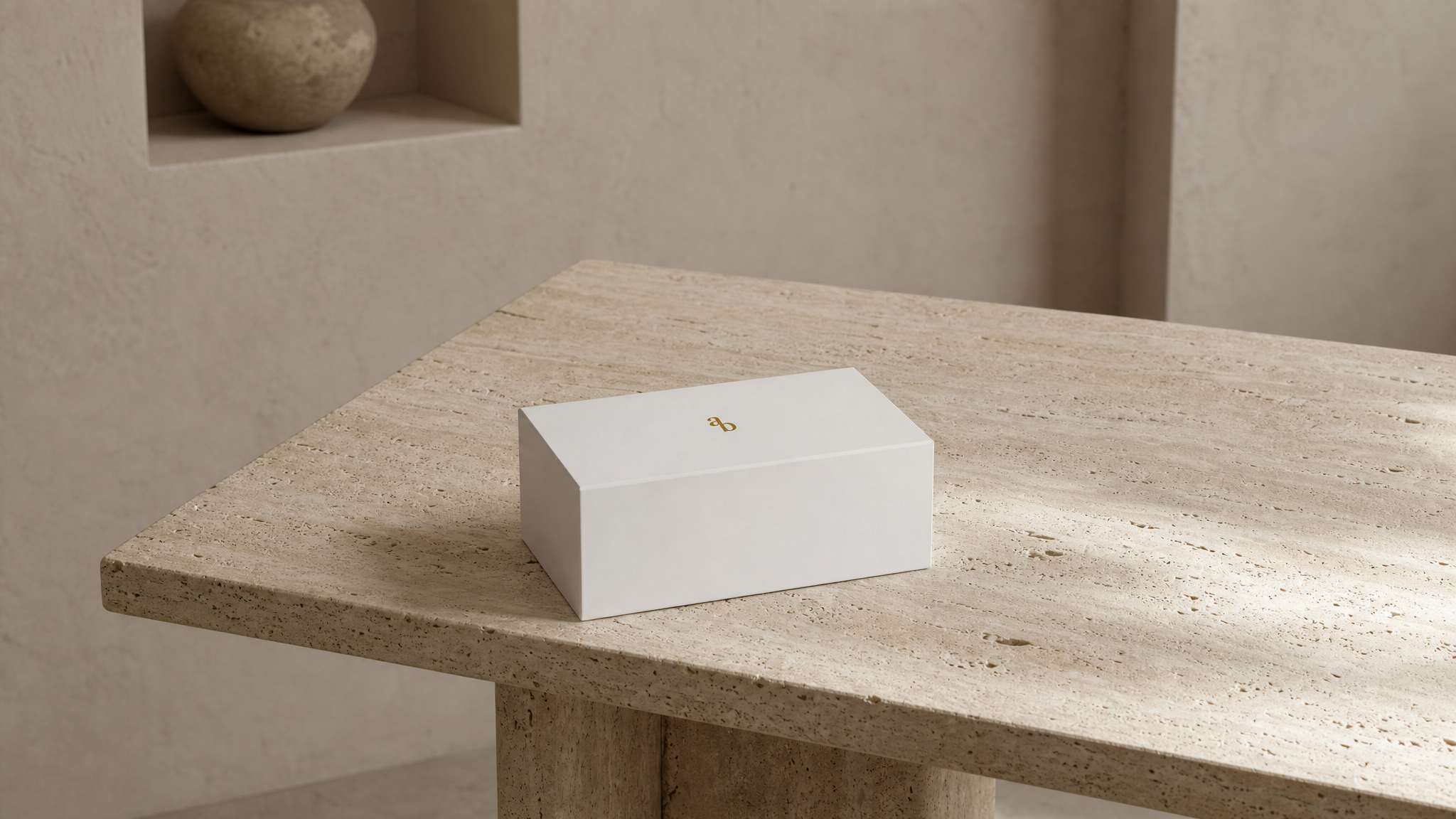 White Ariblake packaging box on a travertine table